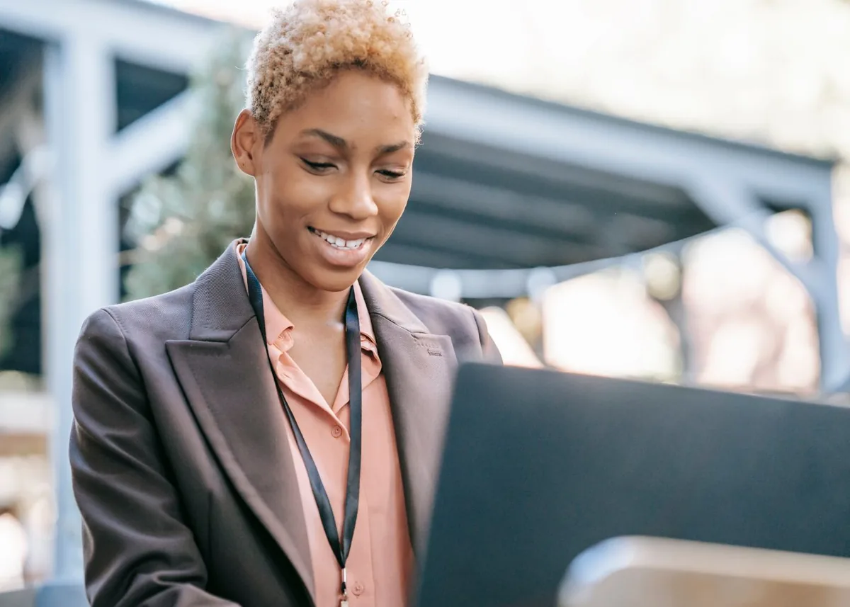 Smiling black businesswoman using a laptop