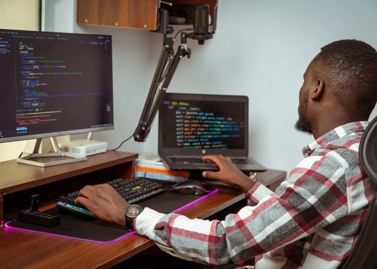 African software developer working on code
